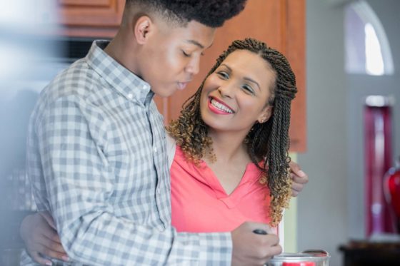 Mother and son in kitchen