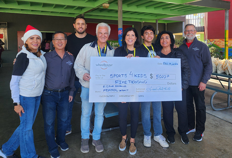 President/CEO, Lisa Paul-Hill stands with the 2025 D. Cruz Gonzalez Memorial Grant recipient and other volunteers.
