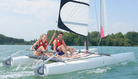 Couple boating on bay