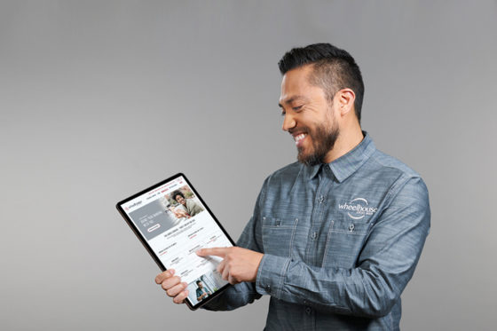 Staff member showing tablet