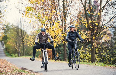 Mature couple on bikes