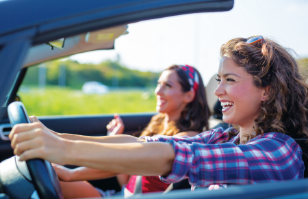 Girls driving in a convertible