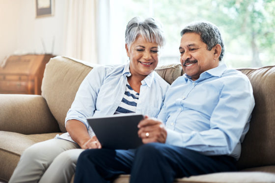 Hispanic couple on sofa