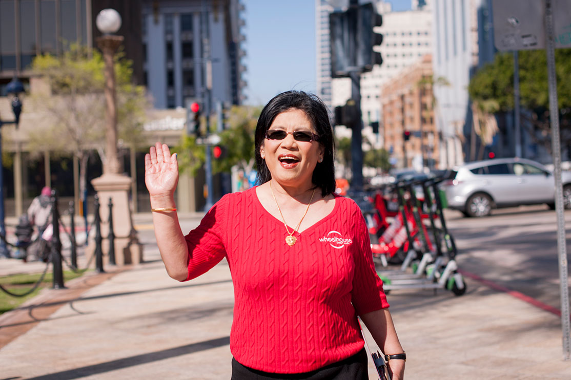 Staff waving outdoors