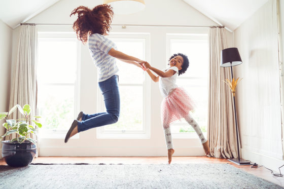 mother daughter jumping