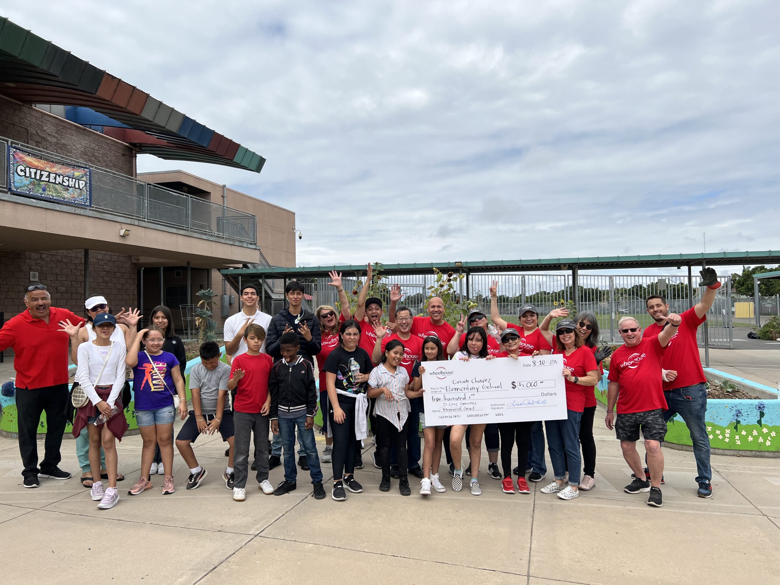 Team Wheelhouse pictured with Cesar Chavez Elementary School students and principal.