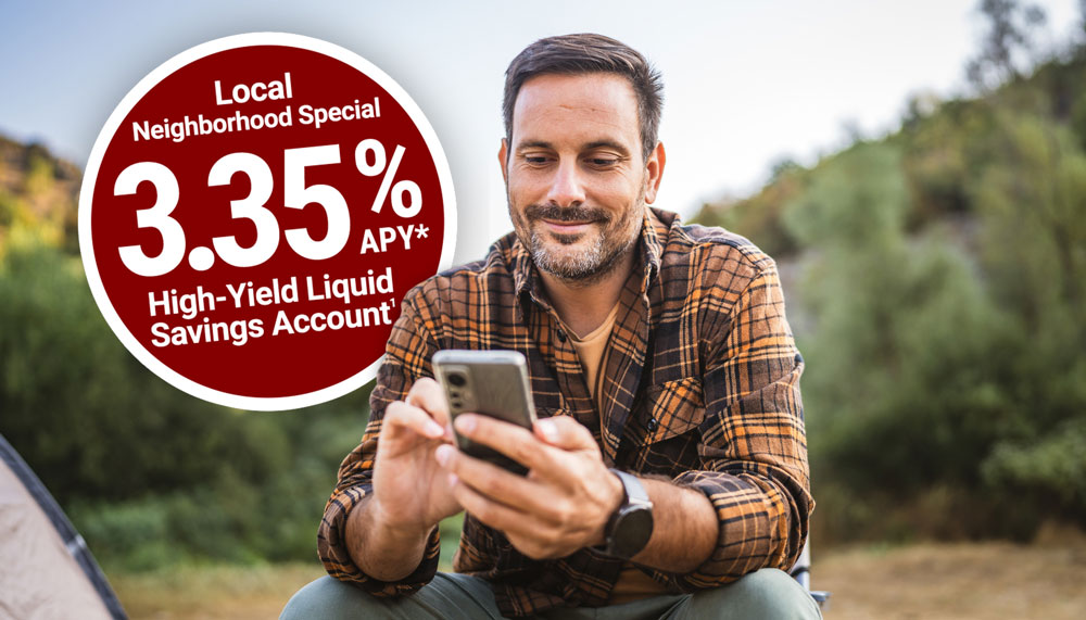 Man holding phone with High-Yield Rates