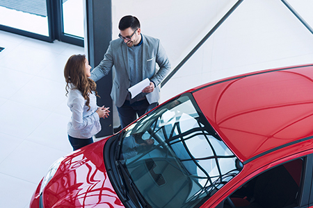 Woman purchasing a car