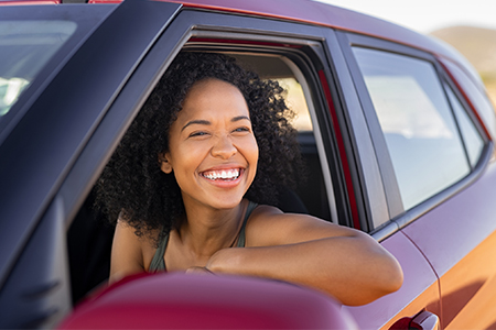 Woman in car smiling