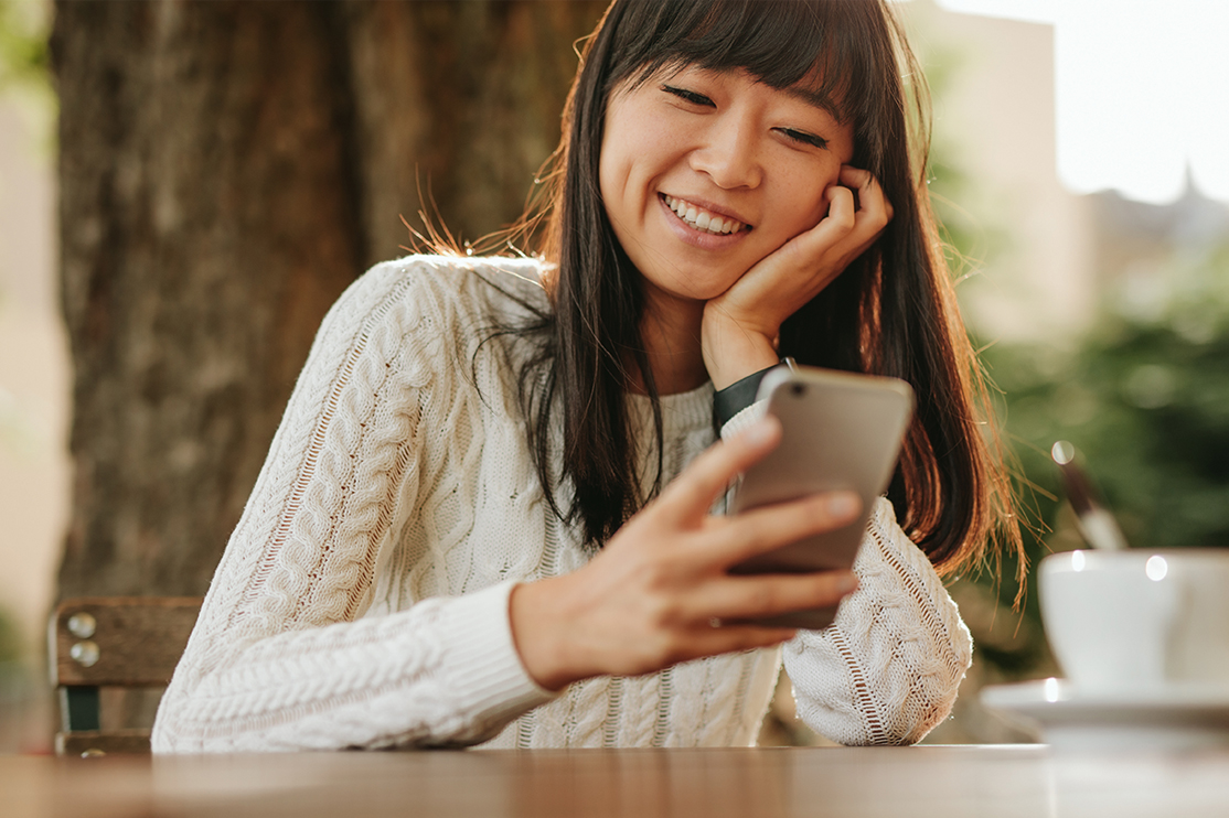 Young girl looking at statements on phone