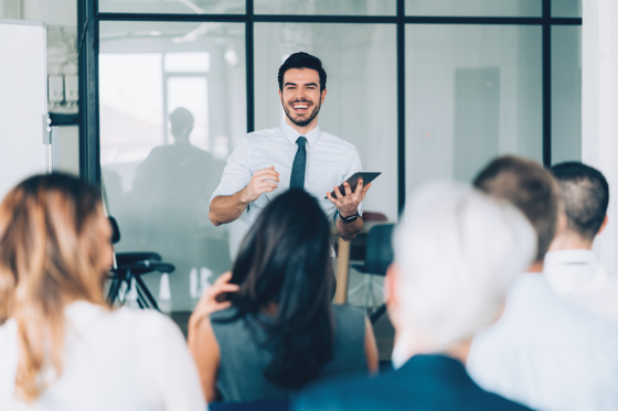 Business man with tablet doing a presentation