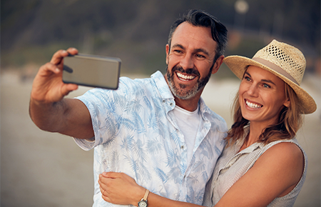 happy couple taking selfie