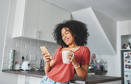 Woman smiling looking at phone