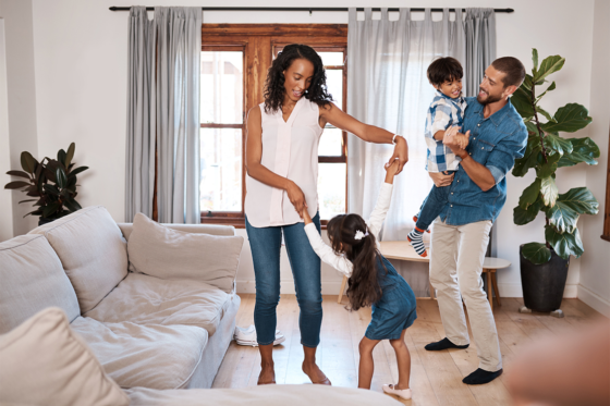 family dancing in living room