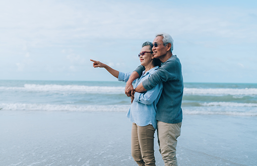 couple beach pointing