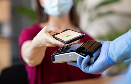 woman using digital wallet to pay