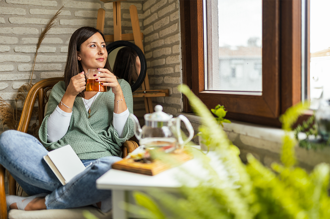 woman relaxed holding tea