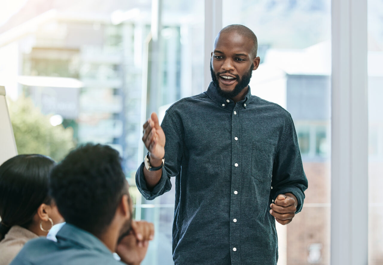 Shot of a businessman giving a presentation during a business meeting stock photo