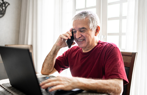 Man phone laptop