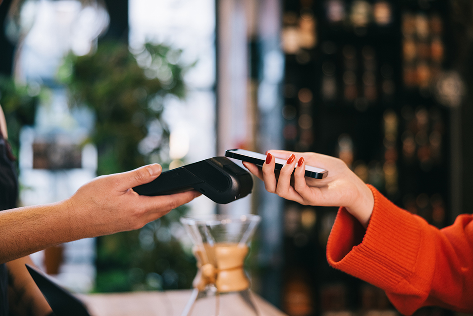 Close up picture of successful smartphone contactless payment at the cafe.