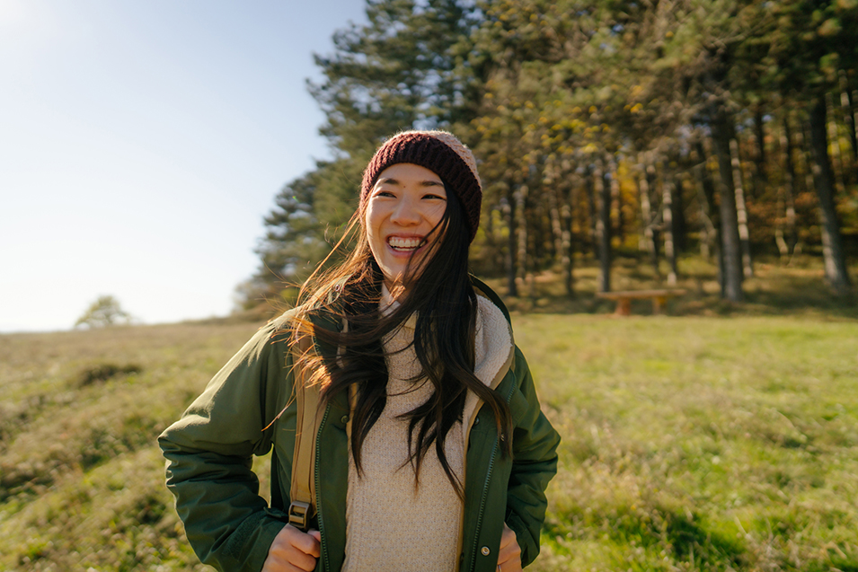 Young Asian woman hiking the beautiful nature.