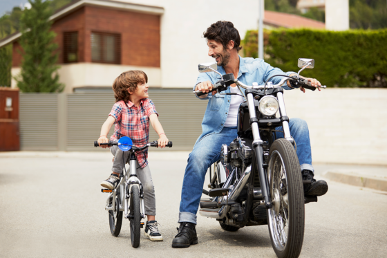 Dad and son on bikes