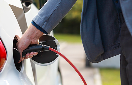 Man charging energy efficient car
