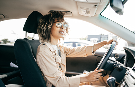 Woman with glasses driving