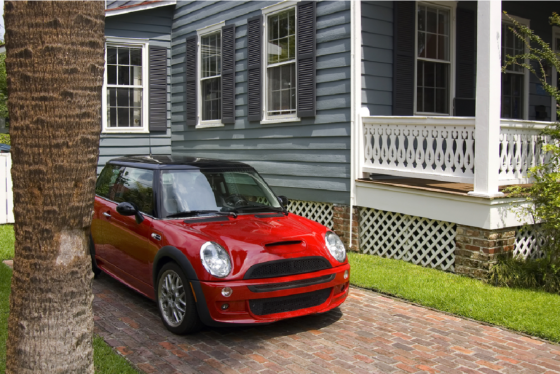 red car in driveway