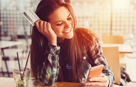 Woman on phone with credit card
