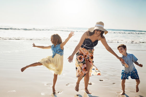 woman kids beach fun